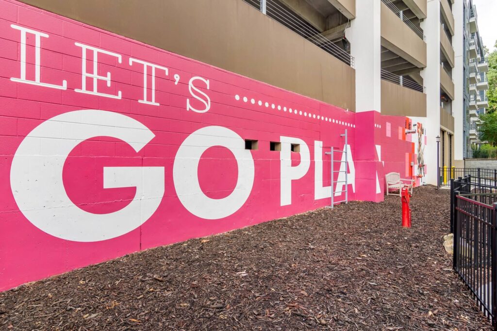 Let's go play mural on the side of parking garage