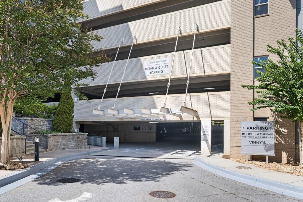 Entrance to a parking garage with signage for Bell Glenridge retail and guest parking.